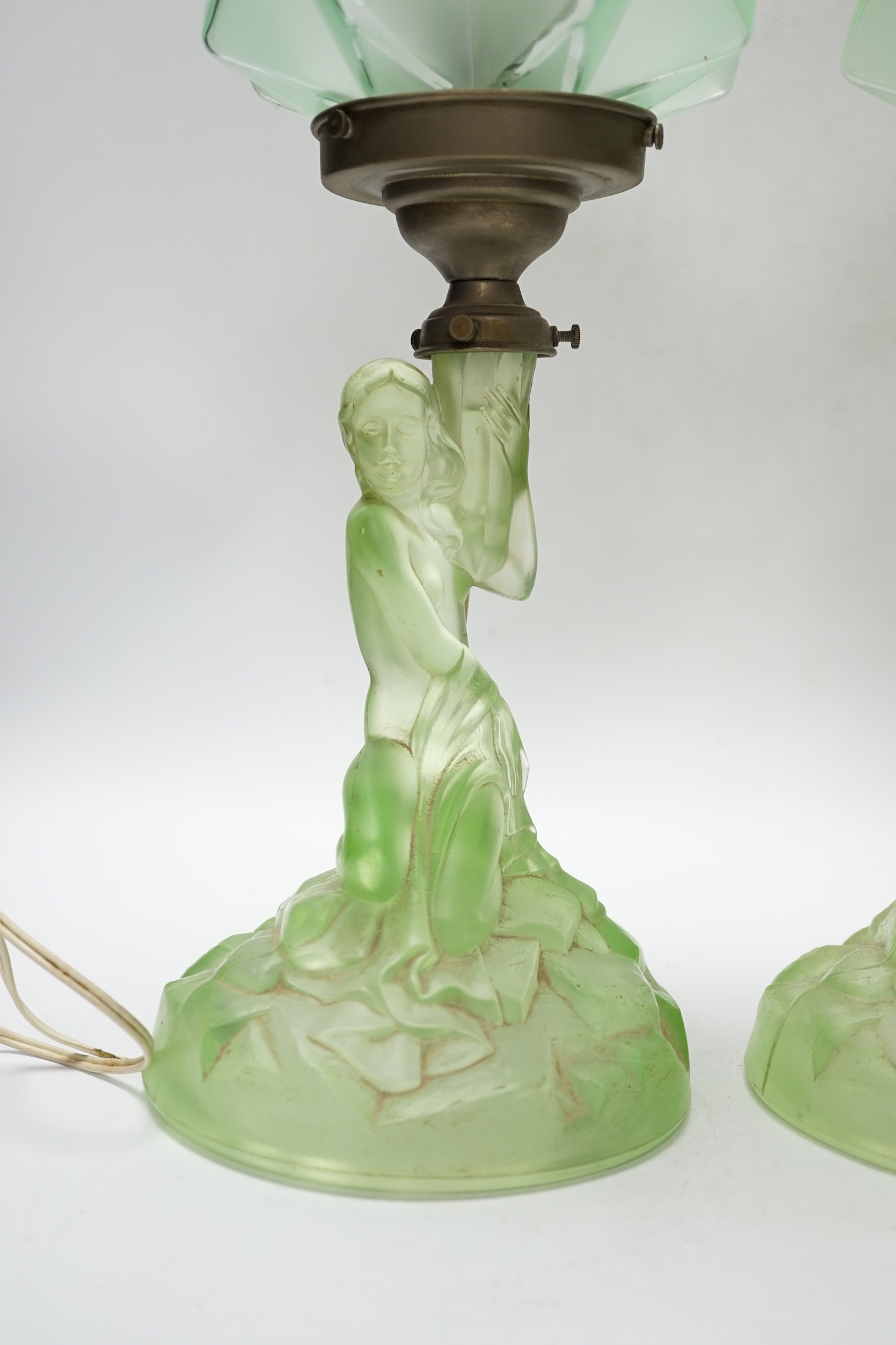 A pair of Art Deco press glass figural table lamps, 40cm